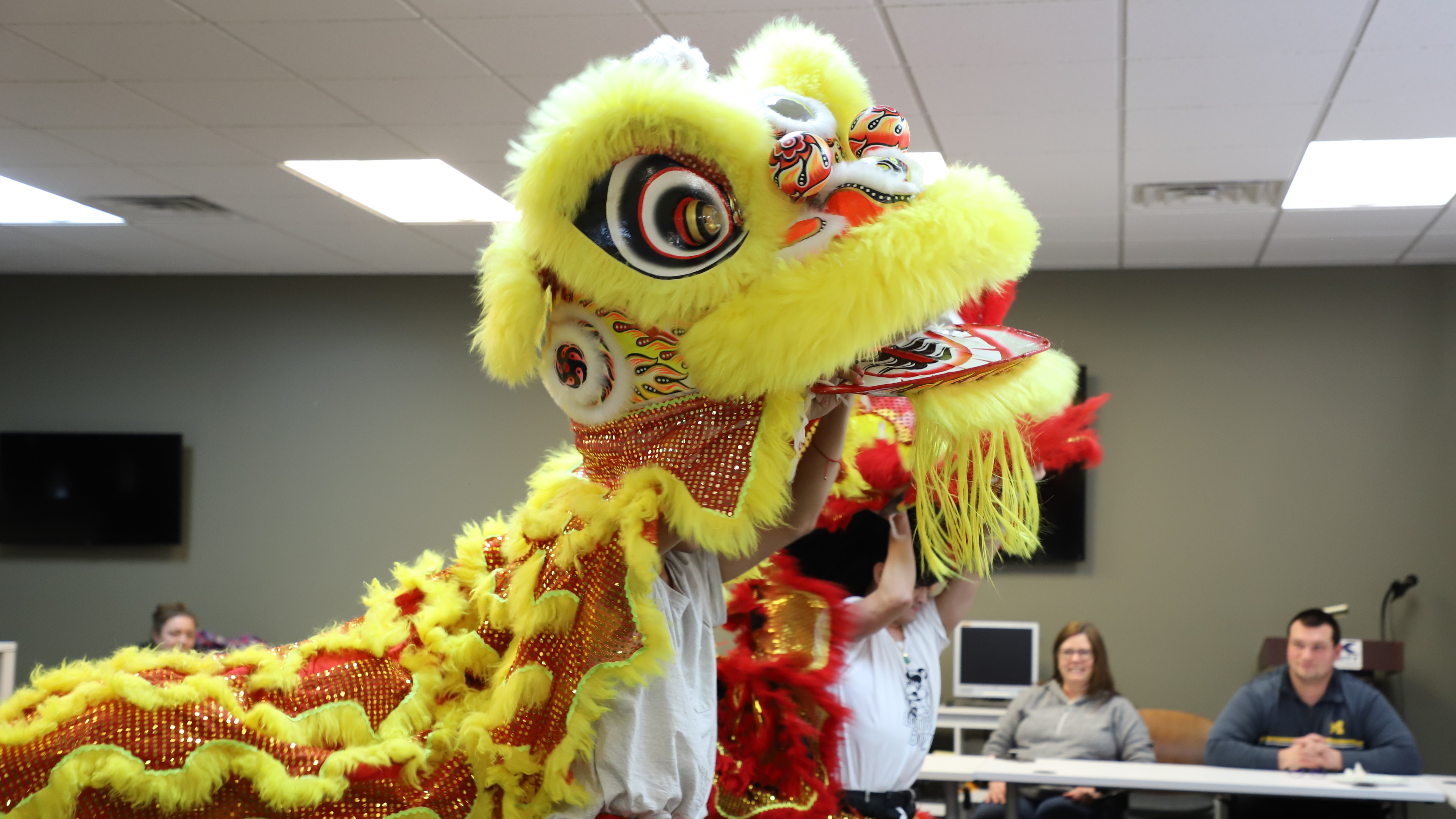 Lotus Boyz GR lion dance group performs at DK Security in Grand Rapids